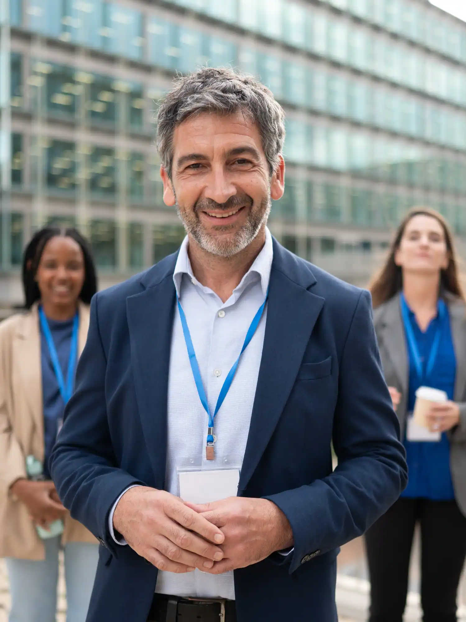 Mature adult businessman smiling leading teamwork