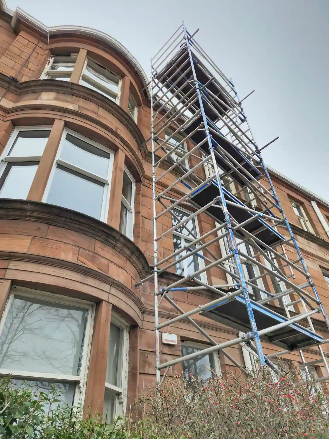 Scaffolding on the facade of an old historical tenement flats